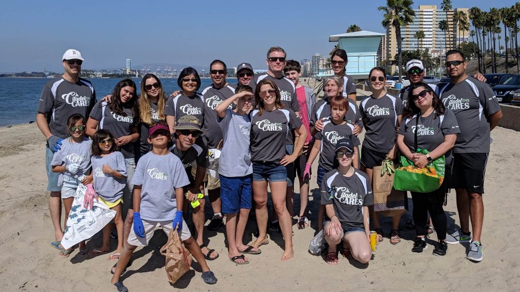 Earth Day. An image of Citadel EHS Employees at a beach cleanup volunteer effort with "Citadel Cares" t-shirts.