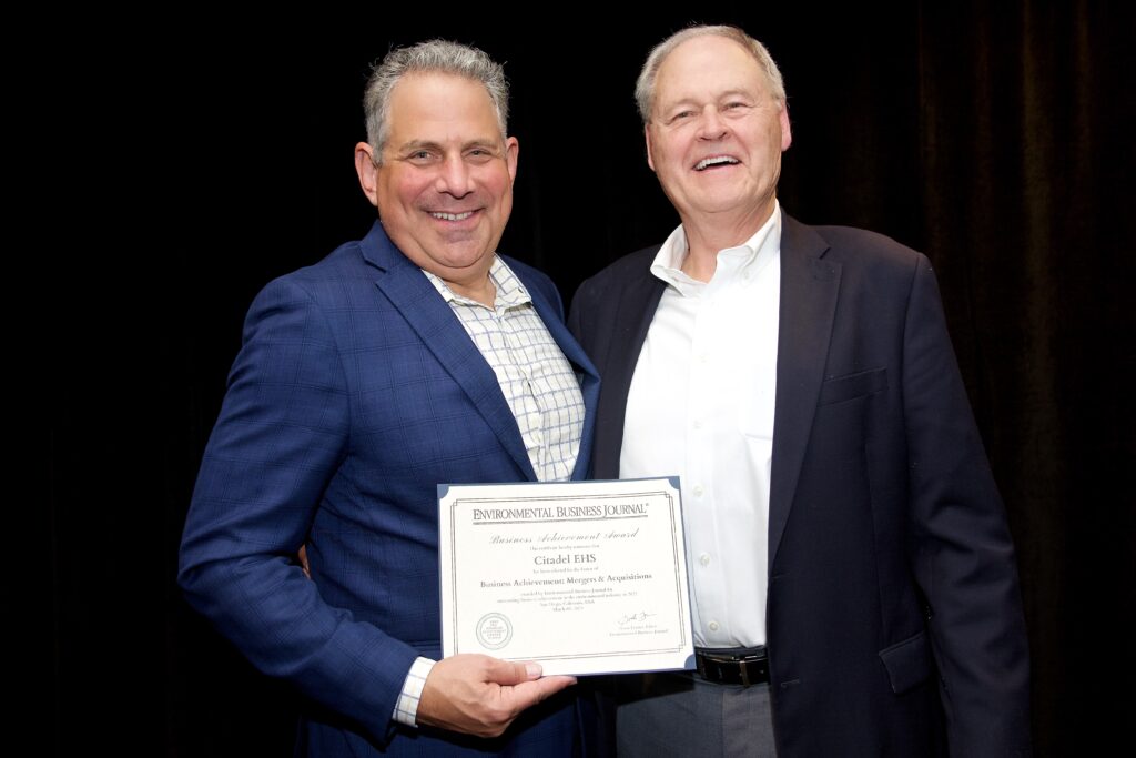 An image of CEO Loren Witkin and George Smith at the Environmental Business Journal (EBJ) Awards ceremony holding Citadel EHS's award for Mergers and Acquisitions