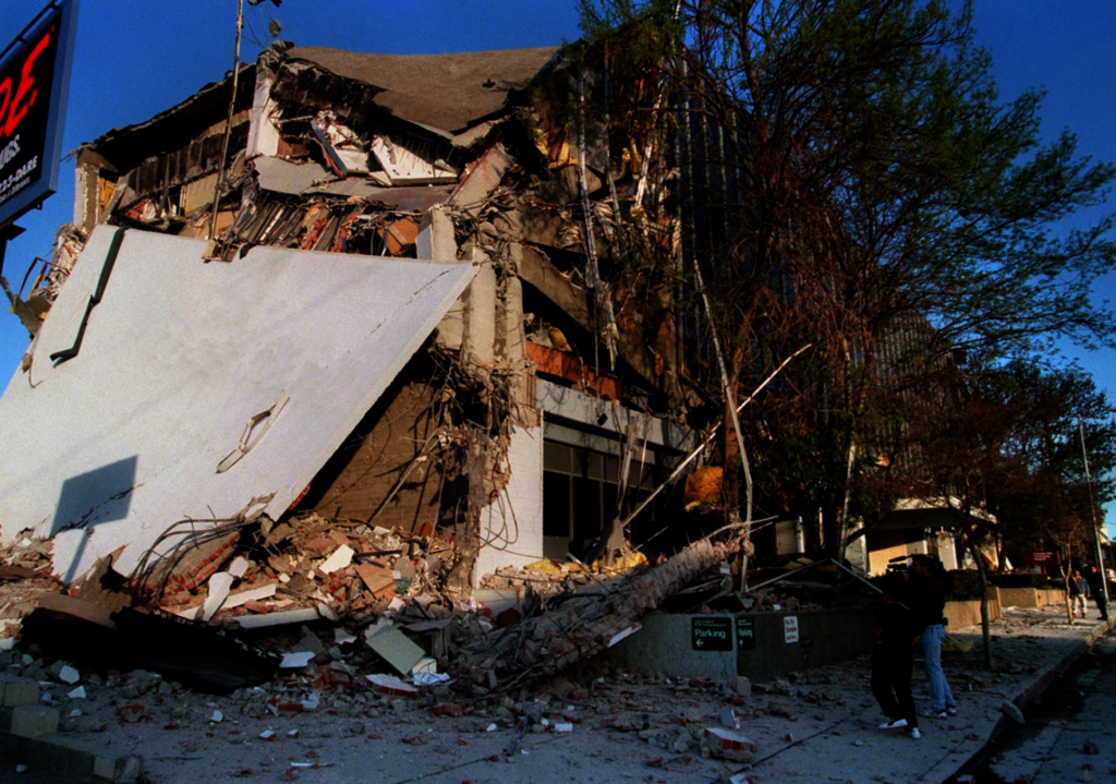 A picture of a collapsed healthcare building in the aftermath of the 1994 Northridge Earthquake, which paved way for the California seismic retrofitting requirements for Hospitals and other qualifying buildings by 2030.